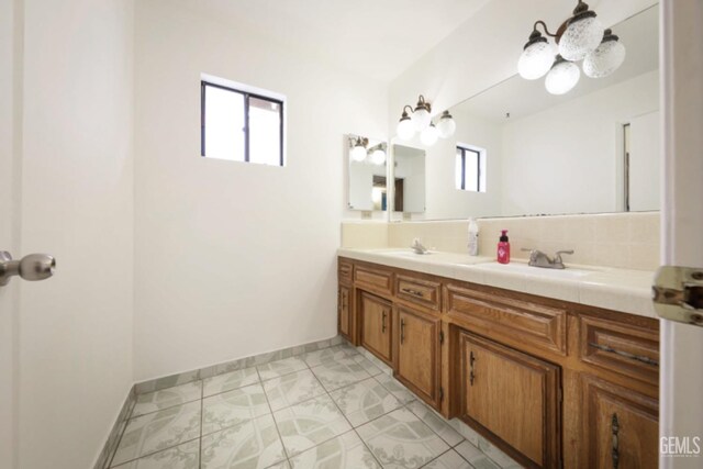 5116 Sherman Ave, Bakersfield, CA 93309 - bathroom featuring vanity and a healthy amount of sunlight