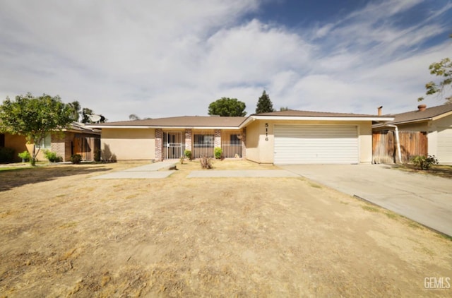 ranch-style house featuring a garage