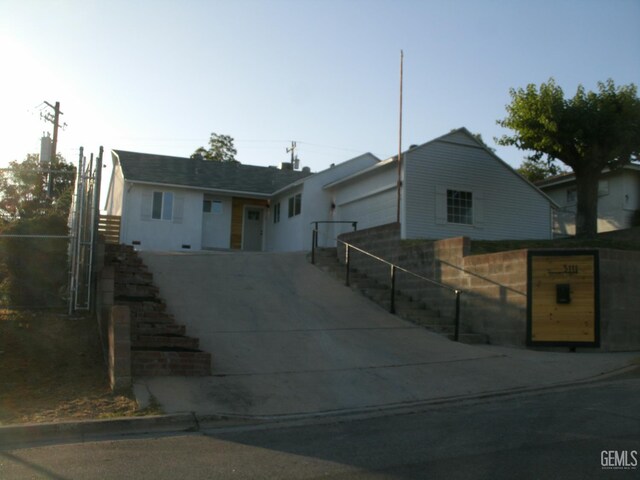 3111 Bucknell St, Bakersfield, CA 93305 - single story home with driveway, stairs, and an attached garage