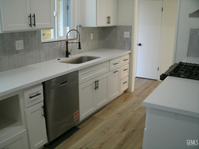 3111 Bucknell St, Bakersfield, CA 93305 - kitchen featuring dishwasher, a sink, light wood-style flooring, white cabinets, and decorative backsplash