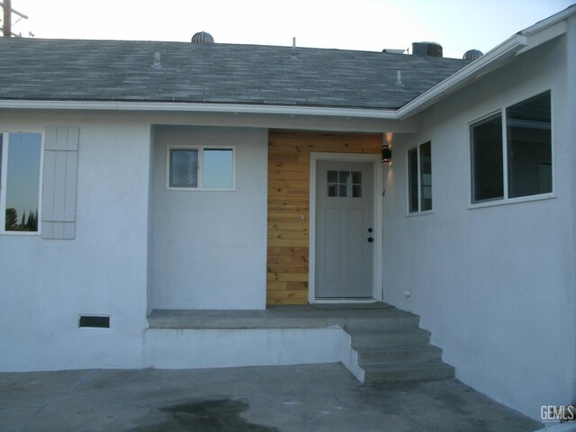 3111 Bucknell St, Bakersfield, CA 93305 - view of exterior entry featuring roof with shingles and stucco siding