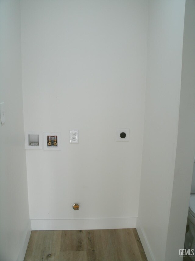 3111 Bucknell St, Bakersfield, CA 93305 - washroom with hookup for an electric dryer, washer hookup, wood finished floors, and baseboards