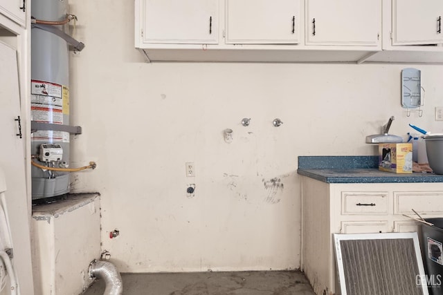 washroom featuring electric dryer hookup and strapped water heater