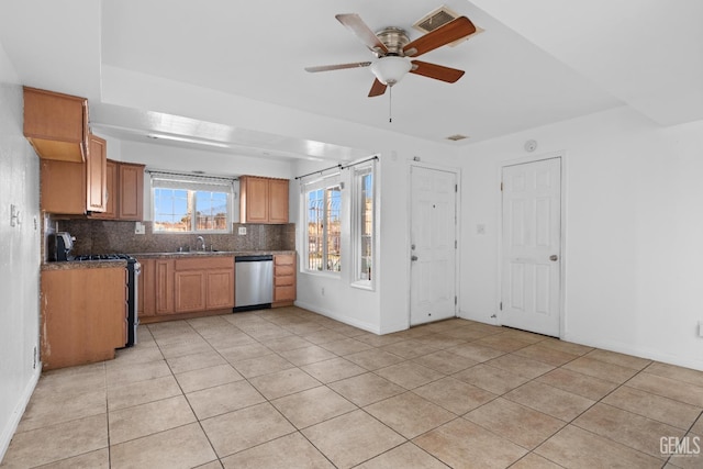 kitchen featuring ceiling fan, sink, light tile patterned floors, and appliances with stainless steel finishes