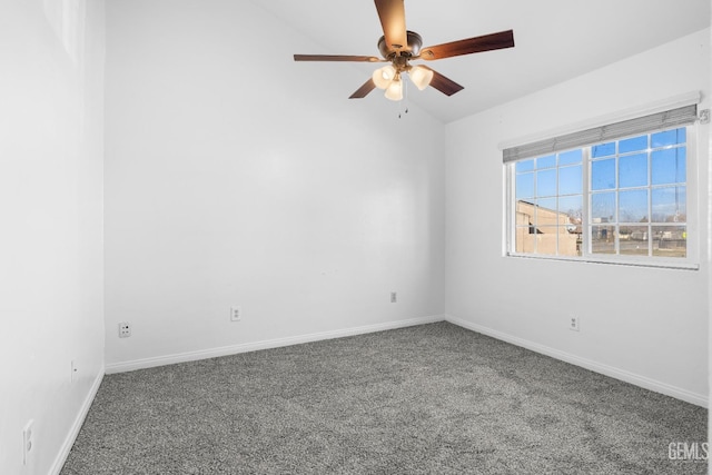 unfurnished room featuring carpet flooring, vaulted ceiling, and ceiling fan