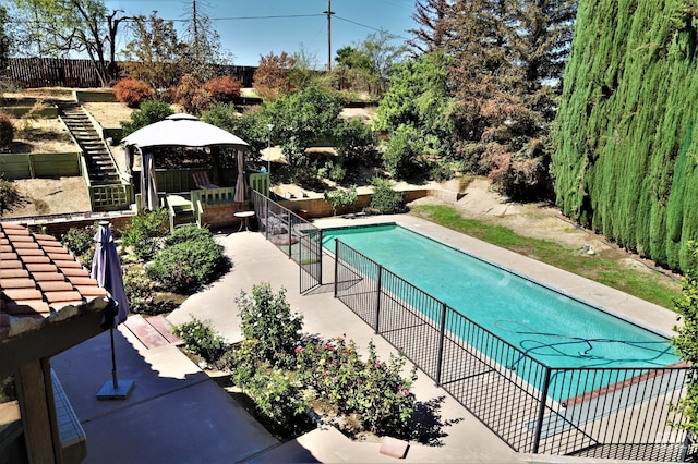 view of pool with a patio area and a gazebo