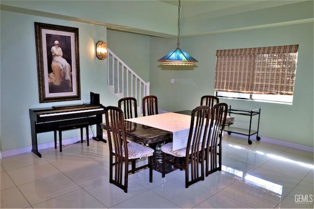 dining space featuring tile patterned flooring