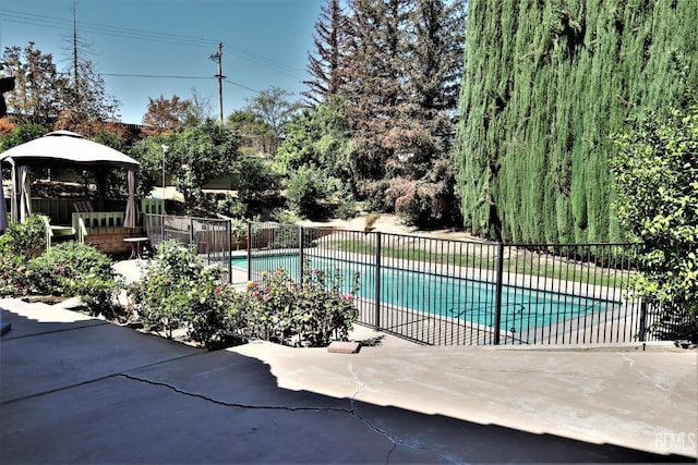 view of pool with a patio area and a gazebo