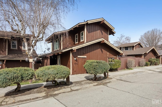 view of front of home featuring fence