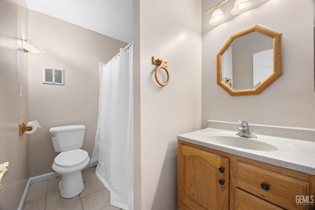 bathroom featuring visible vents, toilet, vanity, baseboards, and tile patterned floors