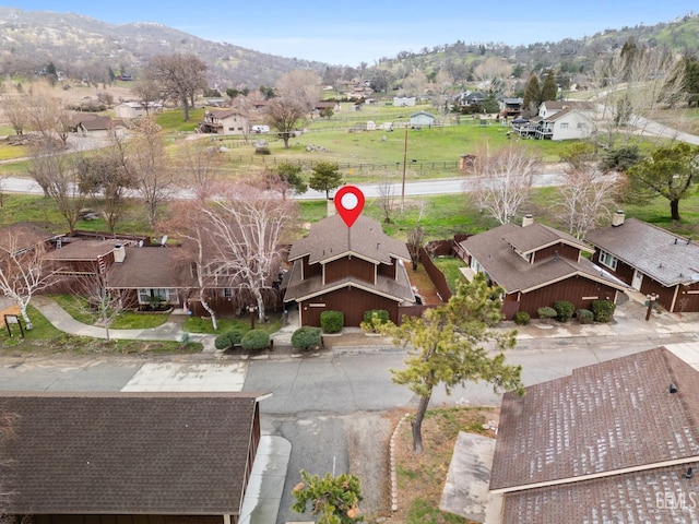 bird's eye view featuring a residential view and a mountain view