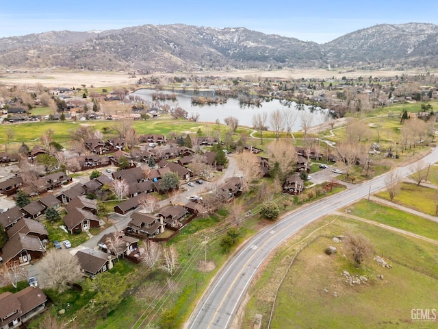 birds eye view of property with a residential view and a water and mountain view