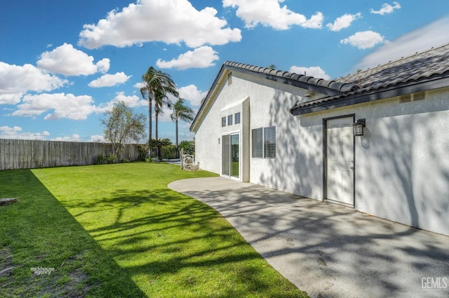 view of yard with a patio area and fence