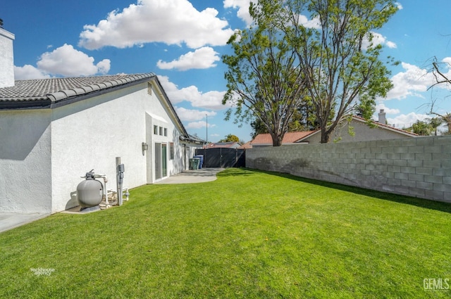 view of yard with a fenced backyard