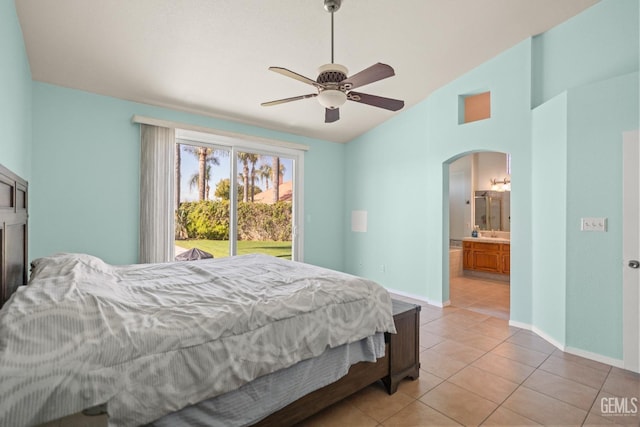 bedroom featuring access to exterior, baseboards, lofted ceiling, light tile patterned floors, and arched walkways