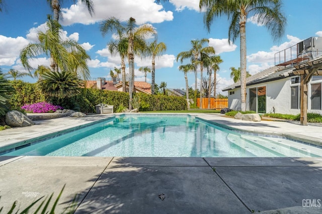 view of pool with a fenced in pool, a patio, and fence