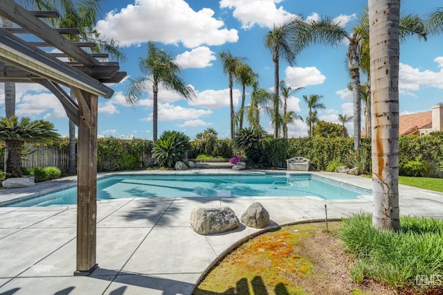 view of pool featuring a patio, a fenced in pool, fence, and a pergola