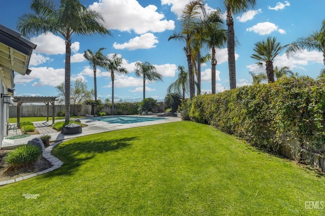 view of yard with a patio area, a fenced in pool, a pergola, and a fenced backyard