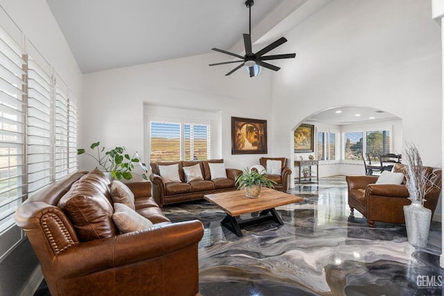 living room with arched walkways, a ceiling fan, high vaulted ceiling, and marble finish floor