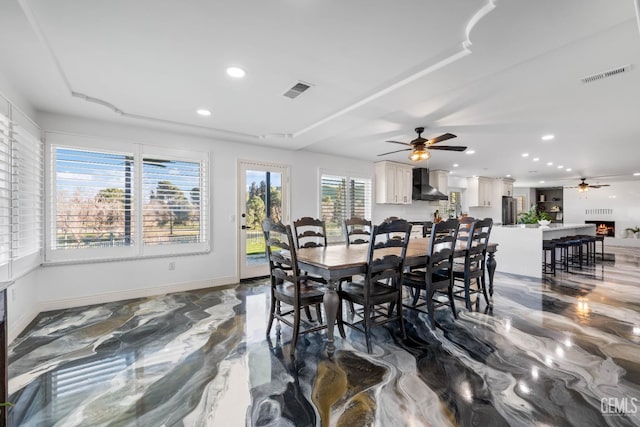 dining space with visible vents, a ceiling fan, baseboards, and recessed lighting