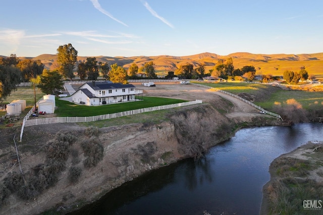 birds eye view of property featuring a water and mountain view