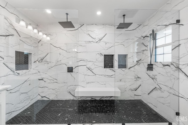 bathroom featuring recessed lighting and a marble finish shower