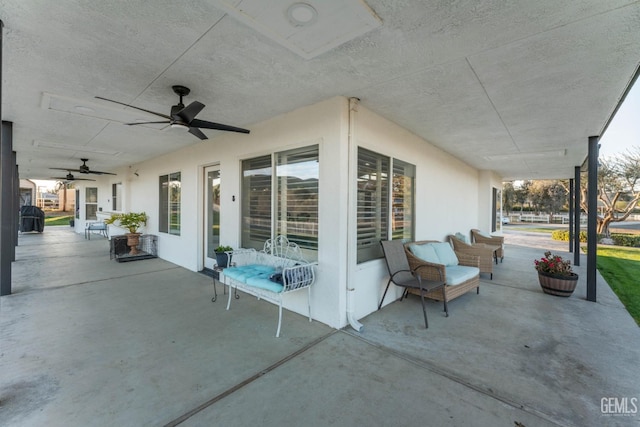 view of patio / terrace featuring ceiling fan