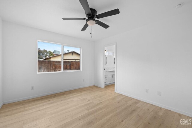 unfurnished bedroom with ceiling fan, light hardwood / wood-style floors, and connected bathroom