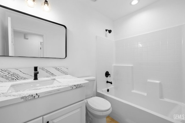 full bathroom featuring vanity,  shower combination, and toilet