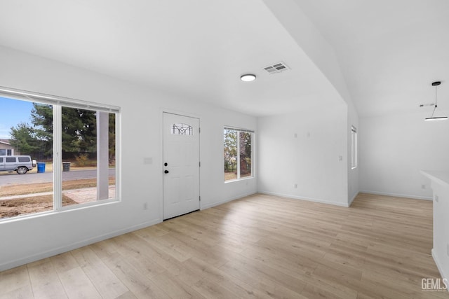 unfurnished living room featuring light hardwood / wood-style floors