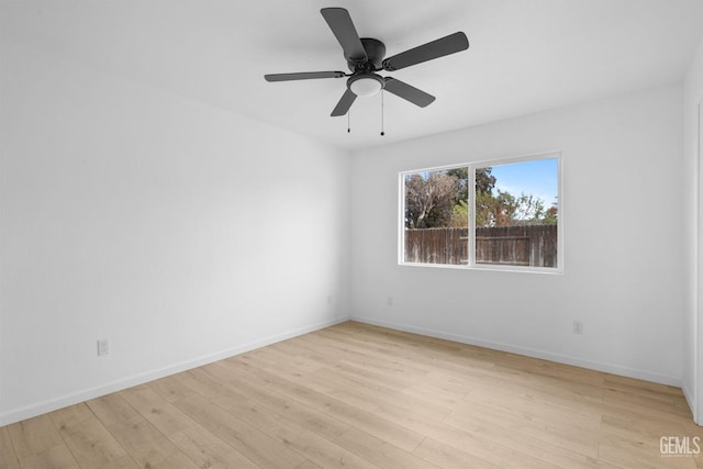 empty room with light hardwood / wood-style flooring and ceiling fan