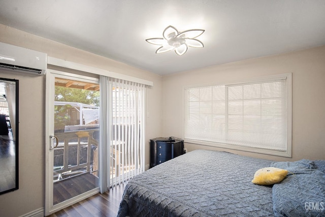 348 Petrol Rd Unit 394, Bakersfield, CA 93308 - bedroom with wood finished floors, access to outside, and a wall mounted air conditioner
