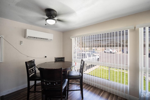 348 Petrol Rd Unit 394, Bakersfield, CA 93308 - dining area featuring a wall mounted air conditioner, ceiling fan, and wood finished floors