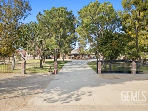 surrounding community featuring a gate and fence