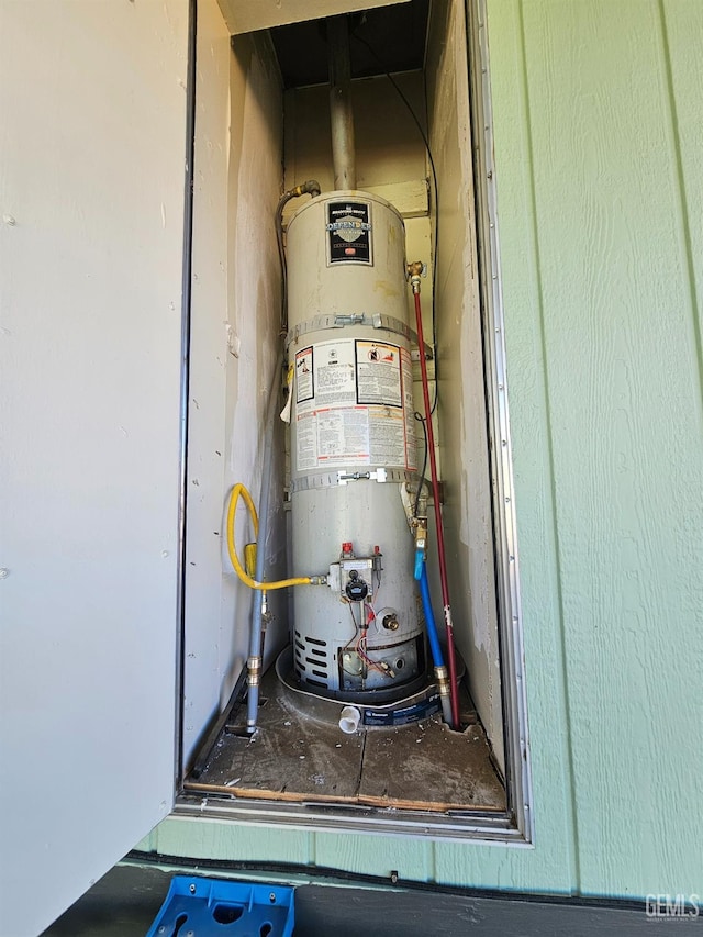 utility room featuring secured water heater