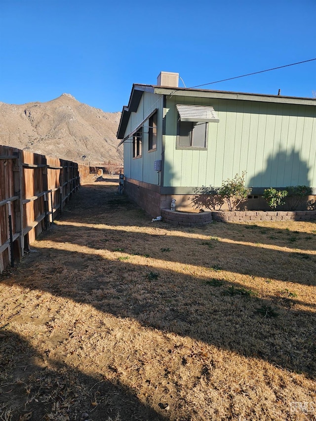 view of property exterior featuring a mountain view