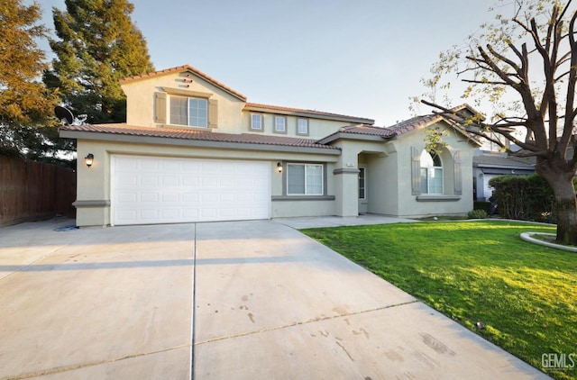 mediterranean / spanish home with a garage and a front lawn