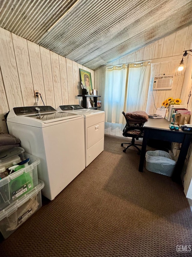 laundry room featuring washer and dryer, laundry area, wooden walls, carpet floors, and a wall unit AC