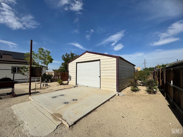 detached garage with fence