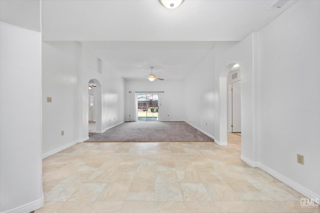 5820 Siena Ln, Bakersfield, CA 93308 - foyer entrance with arched walkways, ceiling fan, and baseboards