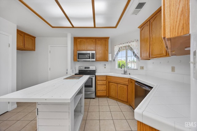 5820 Siena Ln, Bakersfield, CA 93308 - kitchen with stainless steel appliances, a sink, light countertops, and open shelves