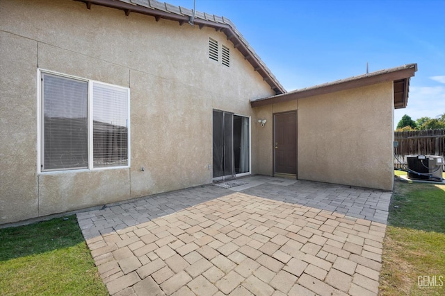 5820 Siena Ln, Bakersfield, CA 93308 - rear view of property featuring stucco siding, a patio area, and cooling unit