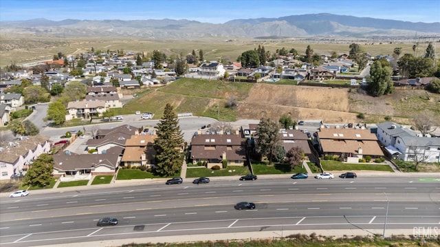 drone / aerial view with a residential view and a mountain view