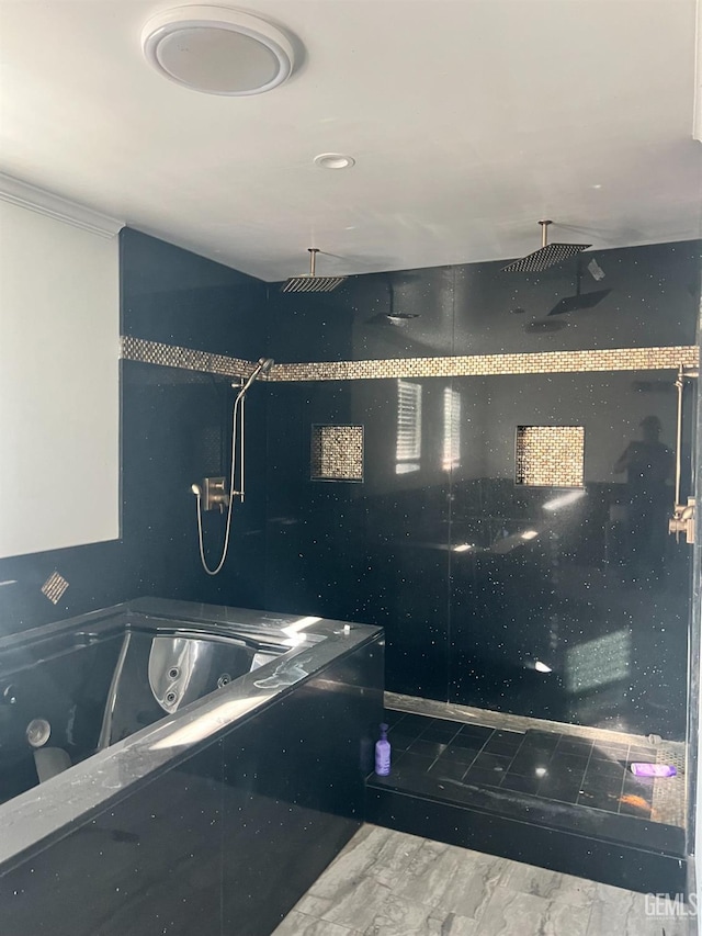 full bathroom featuring crown molding, walk in shower, and a tub with jets