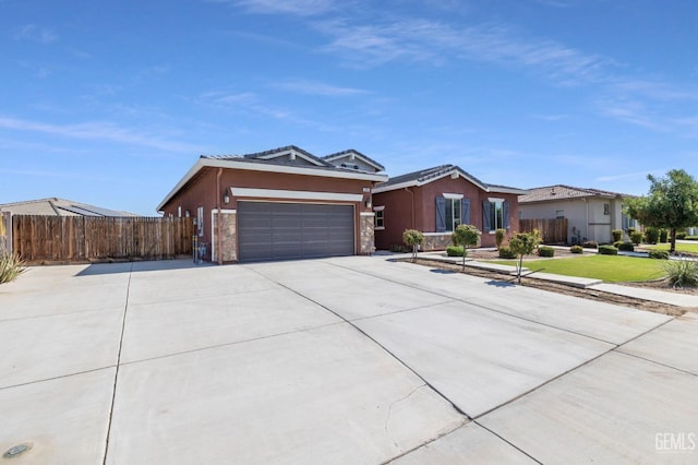 ranch-style home featuring a garage