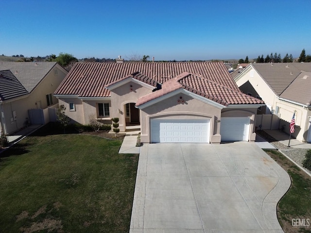 mediterranean / spanish-style home featuring stucco siding, an attached garage, a tile roof, and a front lawn