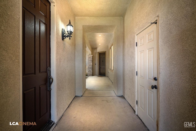 hallway with a textured wall