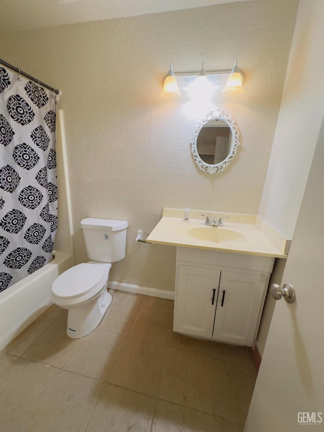 bathroom with vanity, baseboards, tile patterned floors, toilet, and shower / bath combo with shower curtain