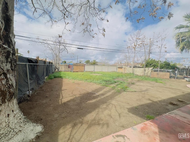 view of yard with a fenced backyard