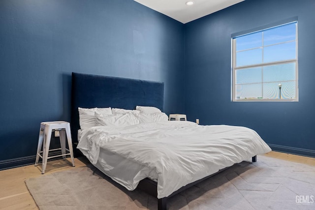 bedroom with light wood-type flooring